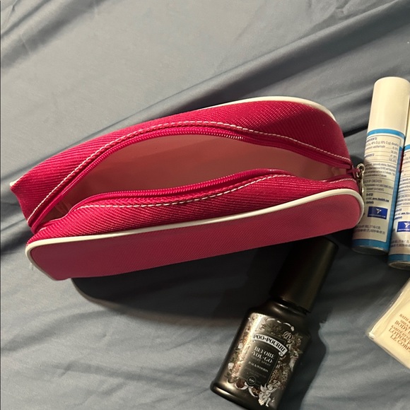 Vibrant Pink Toiletry Bag with Zipper and travel items. - Picture 7 of 14